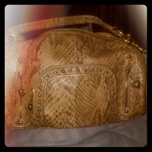 Snake print Kathy Van Zeeland purse with charms